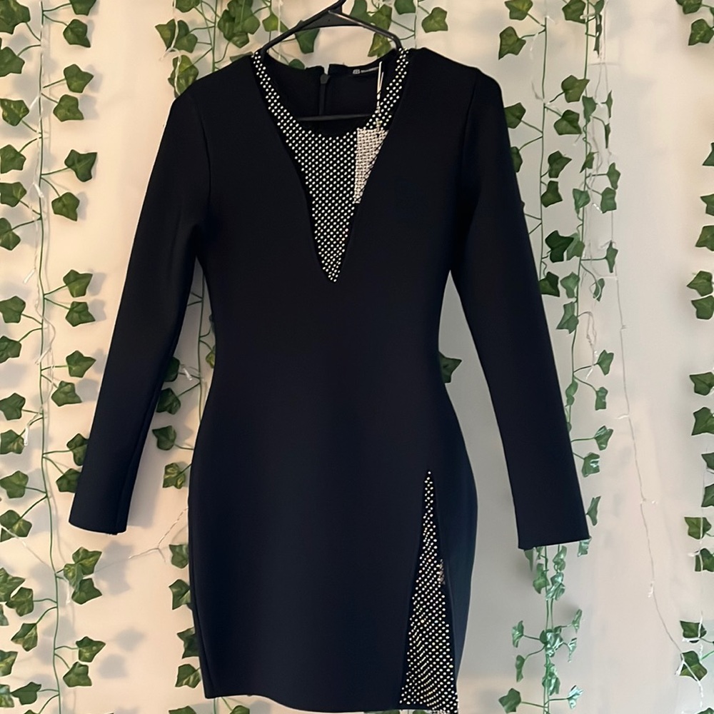 I am selling a black long sleeve dress. This dress was never worn.